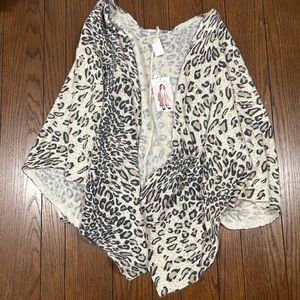 Multi-use cheetah Shawl.